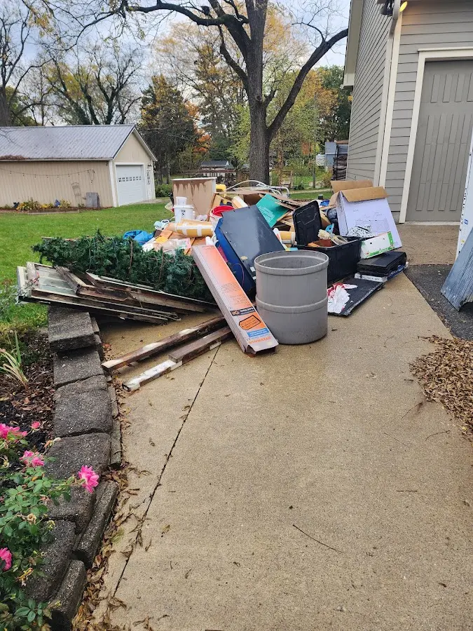 Dumpster being loaded with debris for 3 Yard Dumpster Rental in Deer Park